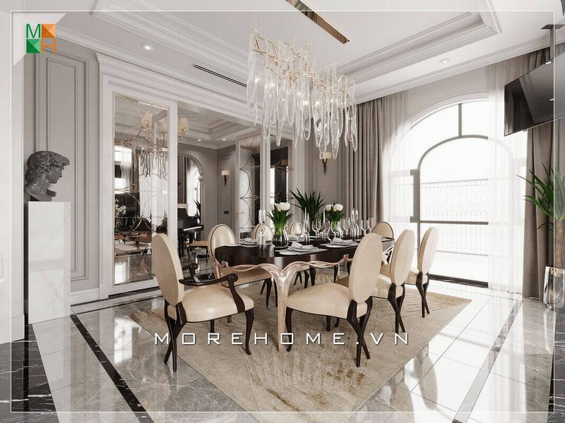 Thiết kế không gian phòng ăn biệt thự hết sức sáng tạo và rộng rãi đón ánh sáng tự nhiên qua khung cửa sổ rộng lớn.Sử dụng mẫu đèn chùm cao cấp cũng là một điểm nhấn của căn phòng ăn. Tất cả tạo nên một không gian phòng ăn cao cấp, sang trọng và hiện đại pha phút tân cổ điển.