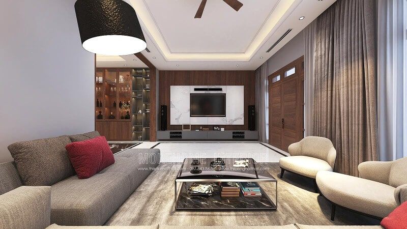 Sự kết hợp giữa đá trắng vân mây, gỗ ốp tường vân óc chó cao cấp mang lại một vẻ đẹp sang trọng và hấp dẫn đến phòng khách hiện đại.