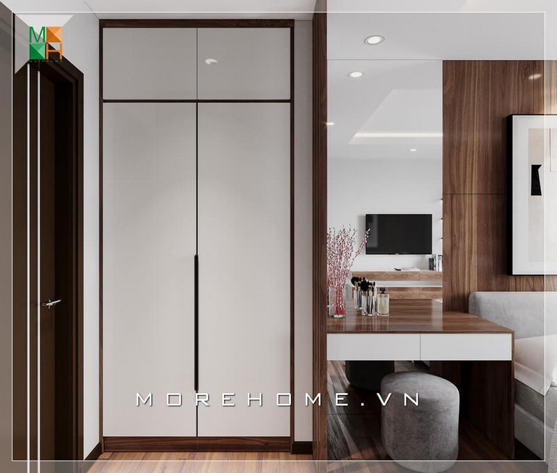 Tủ quần áo phòng ngủ thiết kế âm tường kịch trần, bàn trang điểm và sofa đôn bọc nhung cùng kết hợp với nhau mang lại sự hiện đại và tiện nghi cho căn phòng ngủ của chung cư, nhà phố.